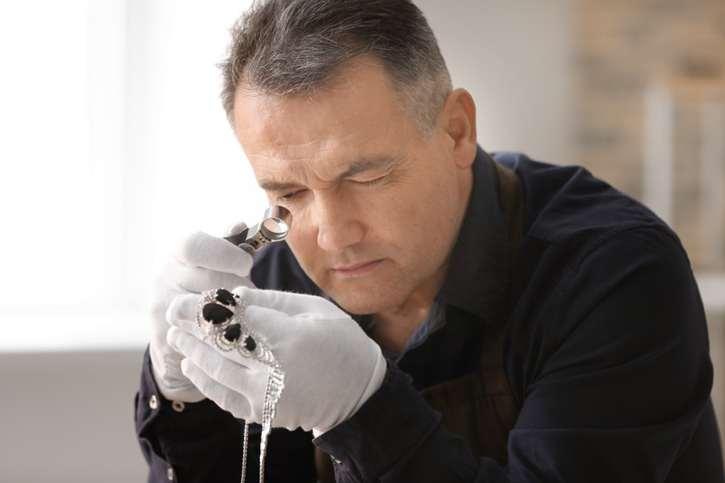 jeweler working in workshop, closeup